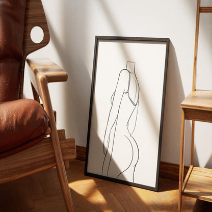 Minimalist backless dress line art in a sleek black frame, showcasing intricate curves.