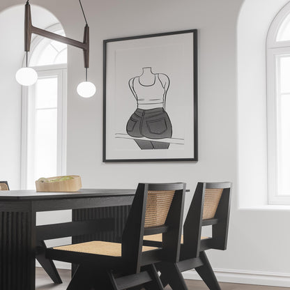 Black and white line art poster of person in jeans on display in modern dining room.